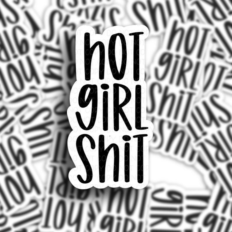 sticker pile of a vinyl adhesive sticker that has the phrase hot girl shit in black letters.