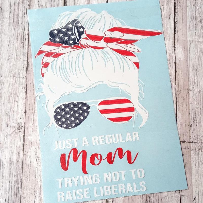 Just A Regular Mom Trying Not to Raise Liberals Vinyl Window Decal.